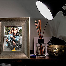 Effect - Bronze photo frame under the light of a lamp